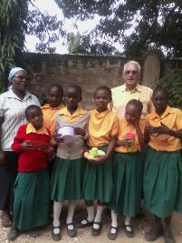Fr Albert with Sr Margaret with pupils from st Vincent de Paul who transited to HGM primary school and performed well in exams
